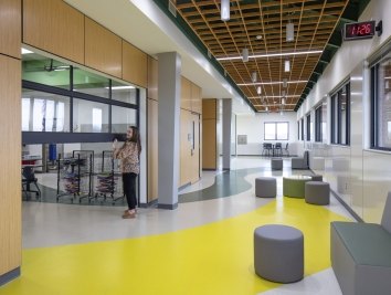 Interior photo of Chandler ISD with a teacher lifting open a classroom door