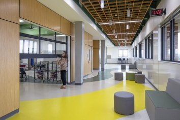 Interior photo of Chandler ISD with a teacher lifting open a classroom door