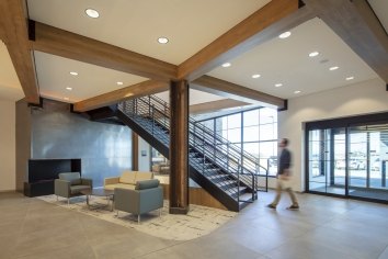 A man walks towards stairs